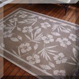 L05. Indoor/outdoor rug. 89” x 63” 